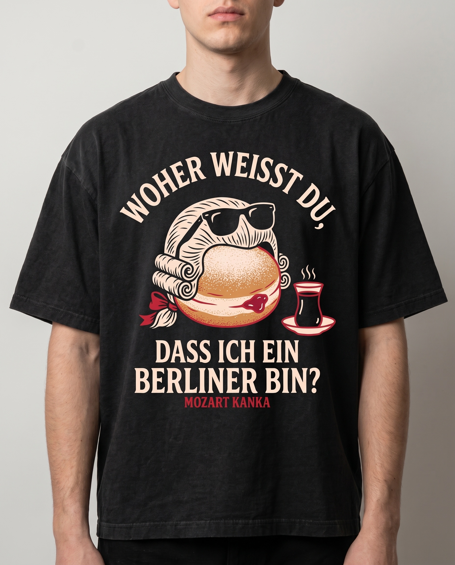 Schwarzes T-Shirt mit Mozart als Berliner-Gebäck und der Frage: Woher weißt du, dass ich ein Berliner bin?
